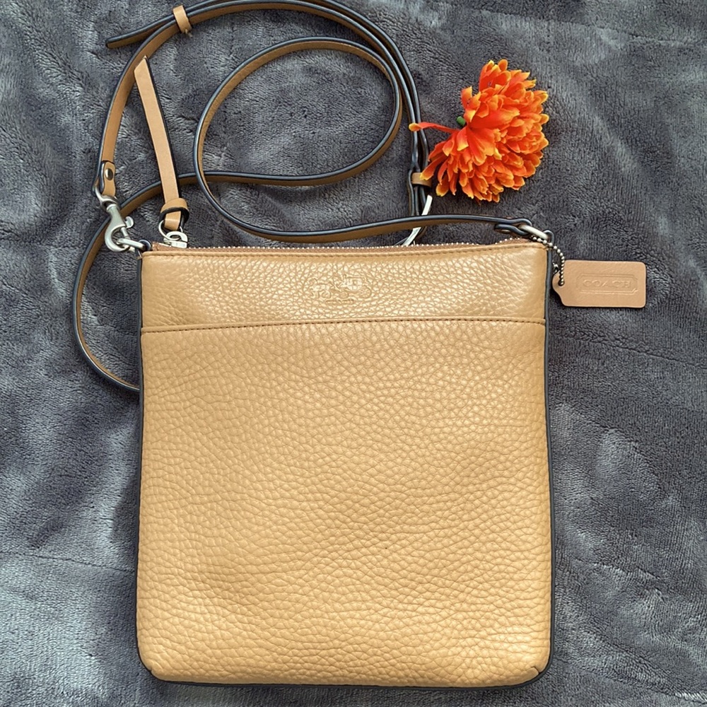 Coach | pebbled leather crossbody. Falls flat against body.